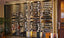 Millesime glass enclosed wine cellar with metal wine shelves