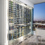 Residential glass enclosed wine cellar with metal display racks