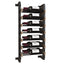 Double row metal and wood wall wine rack with fourteen bottles of wine on a white background
